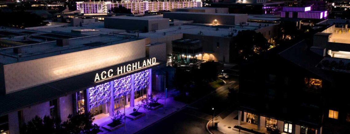 ACC Highland Campus at night with purple accent lights